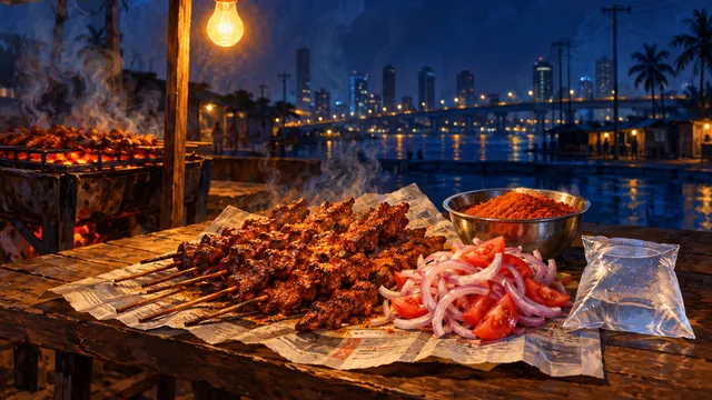 Painting of freshly grilled suya skewers on a newspaper spread on a wooden table, with sliced onion and tomato, a steel bowl of red yaji spice and a sachet of pure water under a bare bulb